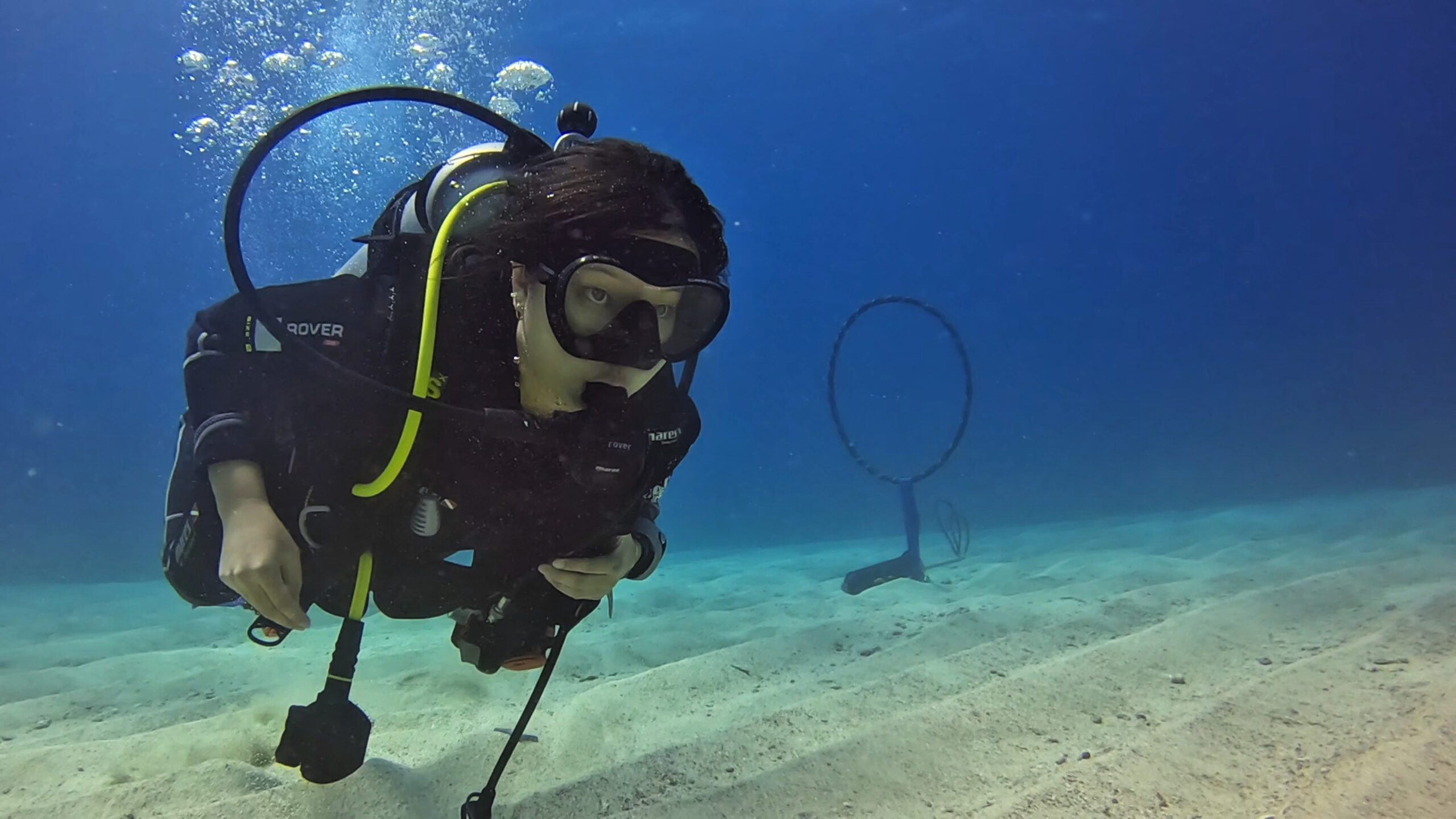 Scuba diver practicing buoyancy control during specialty training in Roatan